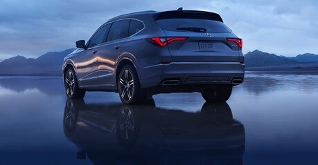 2026 MDX rear view on a reflective lakebed (Premium Performance SUV)